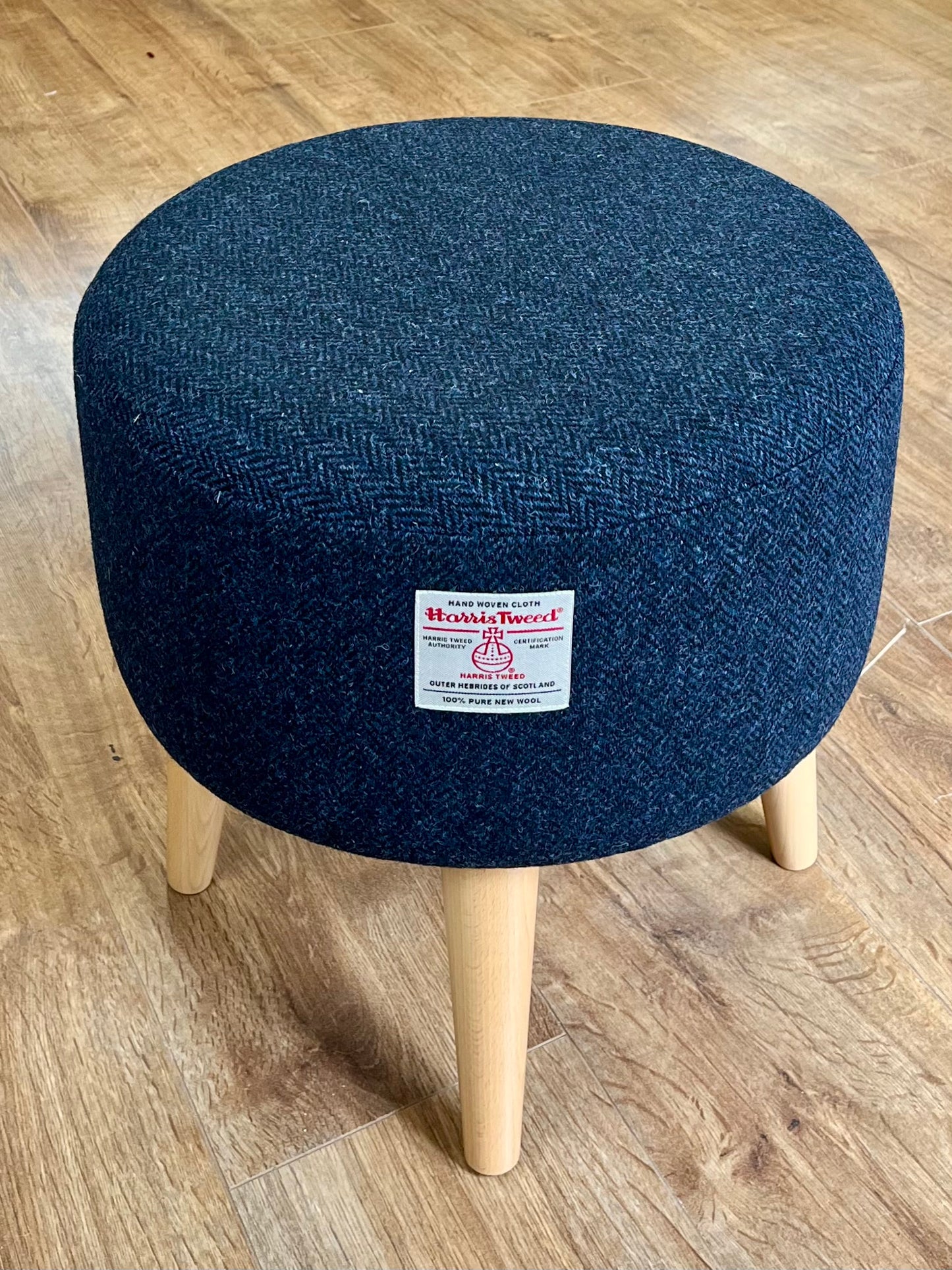 Navy Blue Harris Tweed Upholstered Footstool with Varnished Wooden Legs.