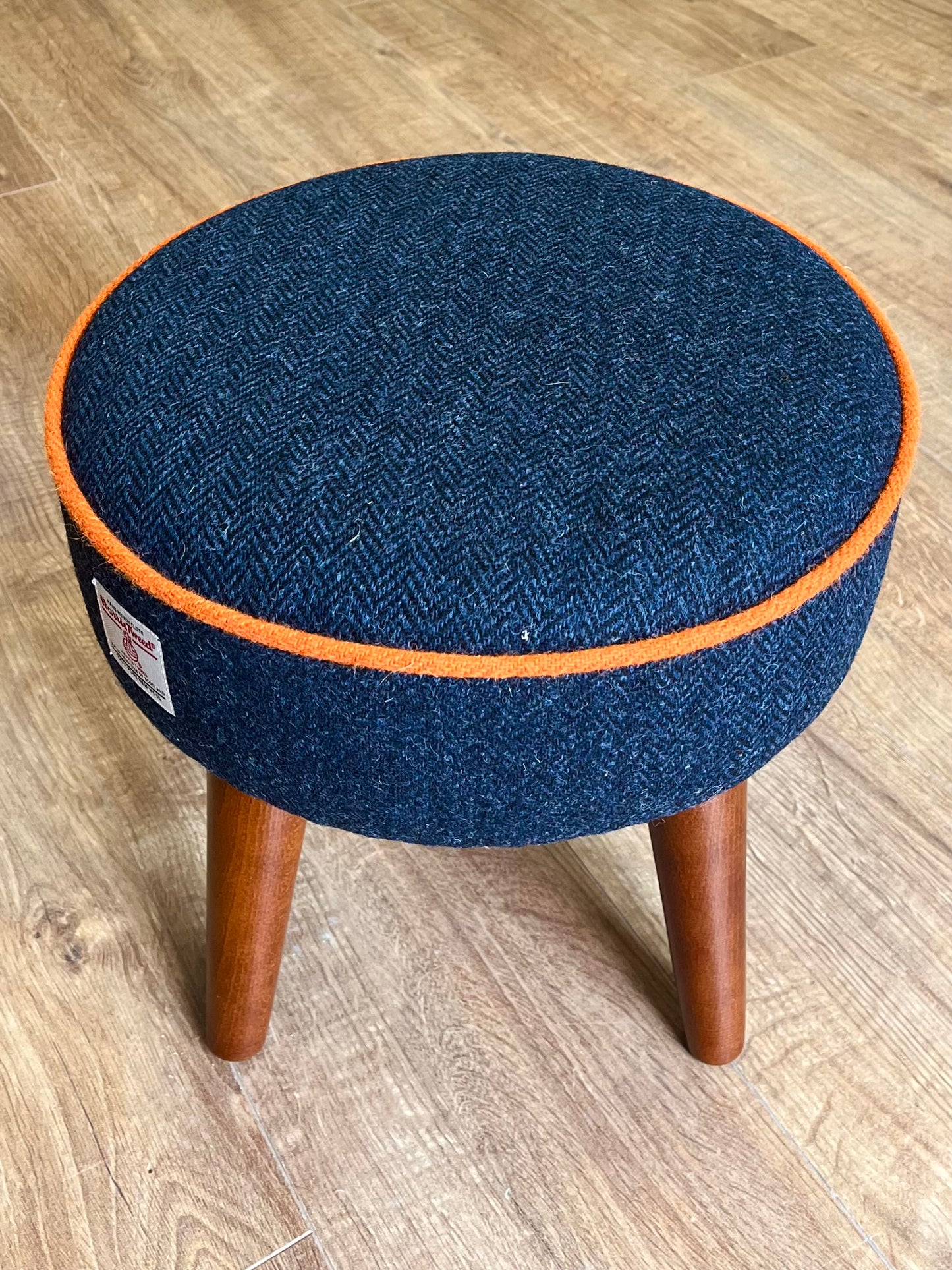 Navy Blue Harris Tweed Footstool with Orange Piping and Dark Varnished Wooden Legs