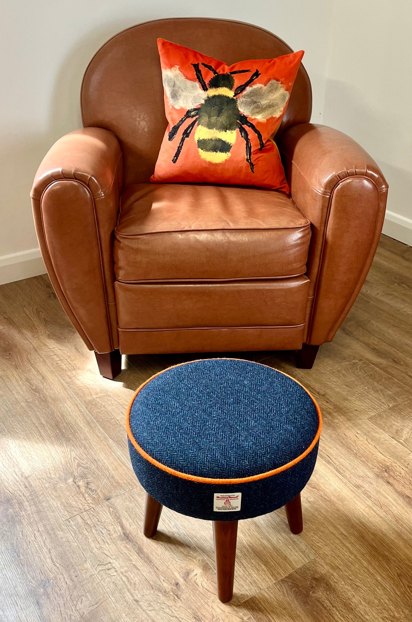 Navy Blue Harris Tweed Footstool with Orange Piping and Dark Varnished Wooden Legs