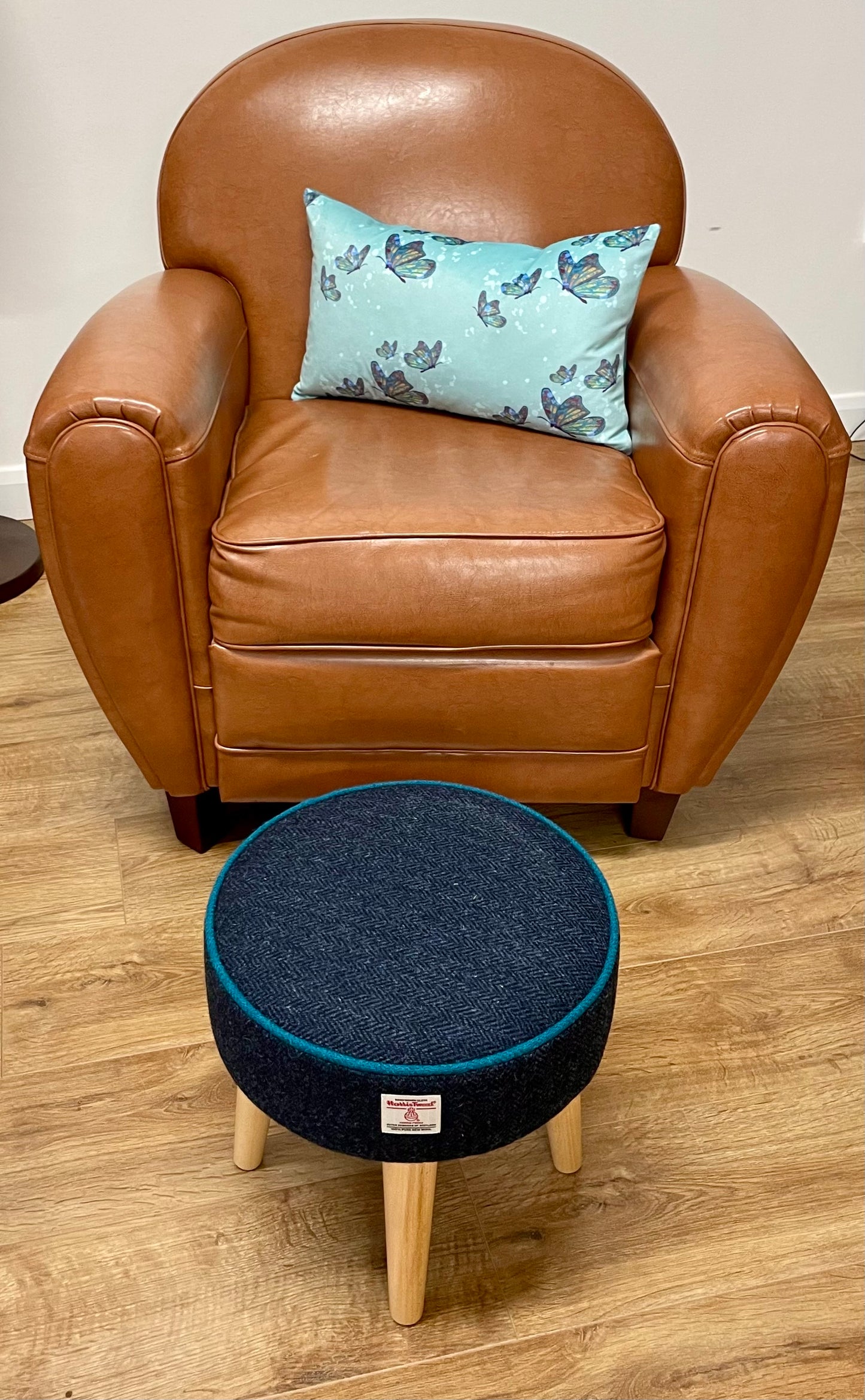 Navy Harris Tweed Footstool with Teal Piping and Varnished Wooden Legs