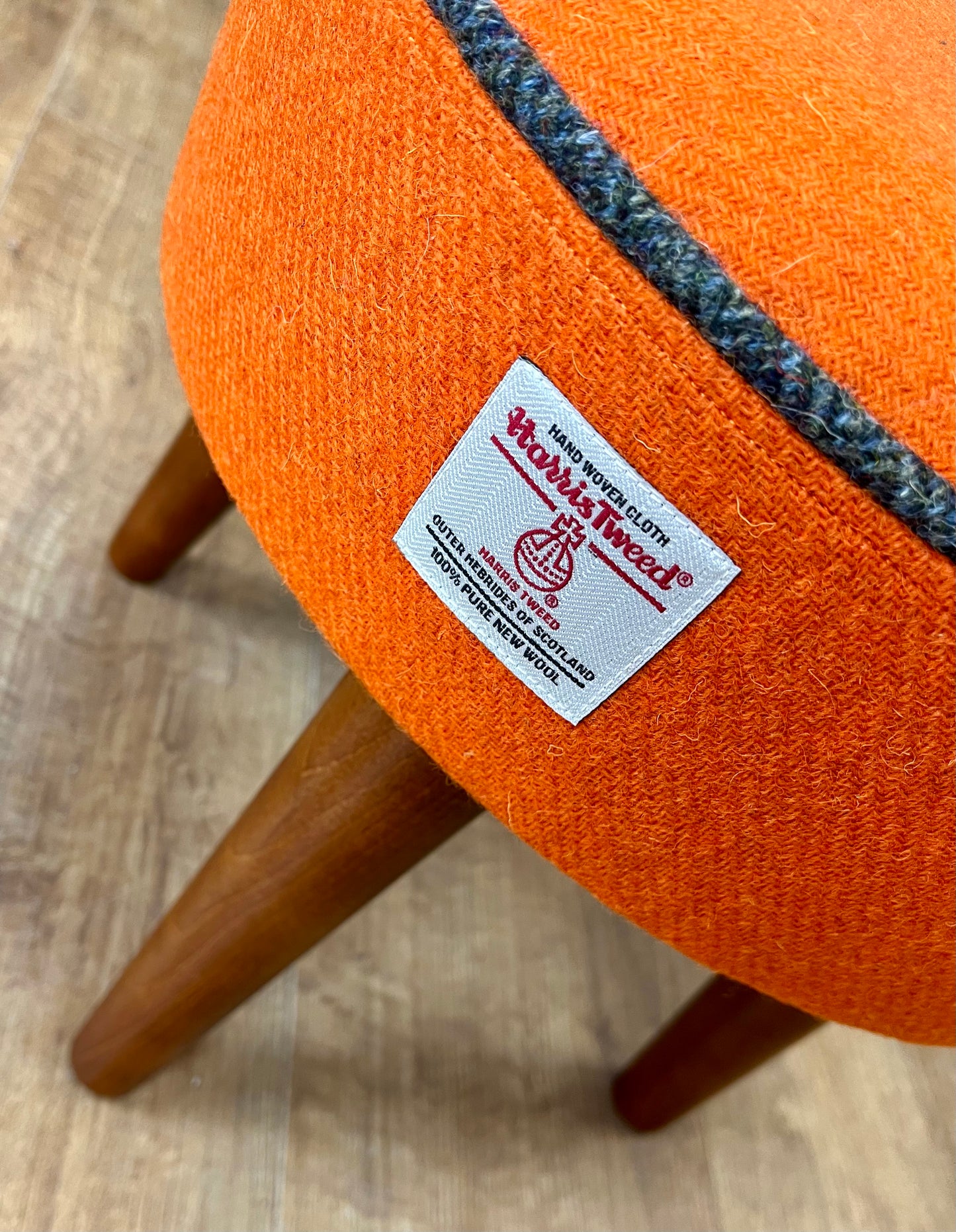 Orange Harris Tweed Footstool with Charcoal Piping and Dark Varnished Wooden Legs