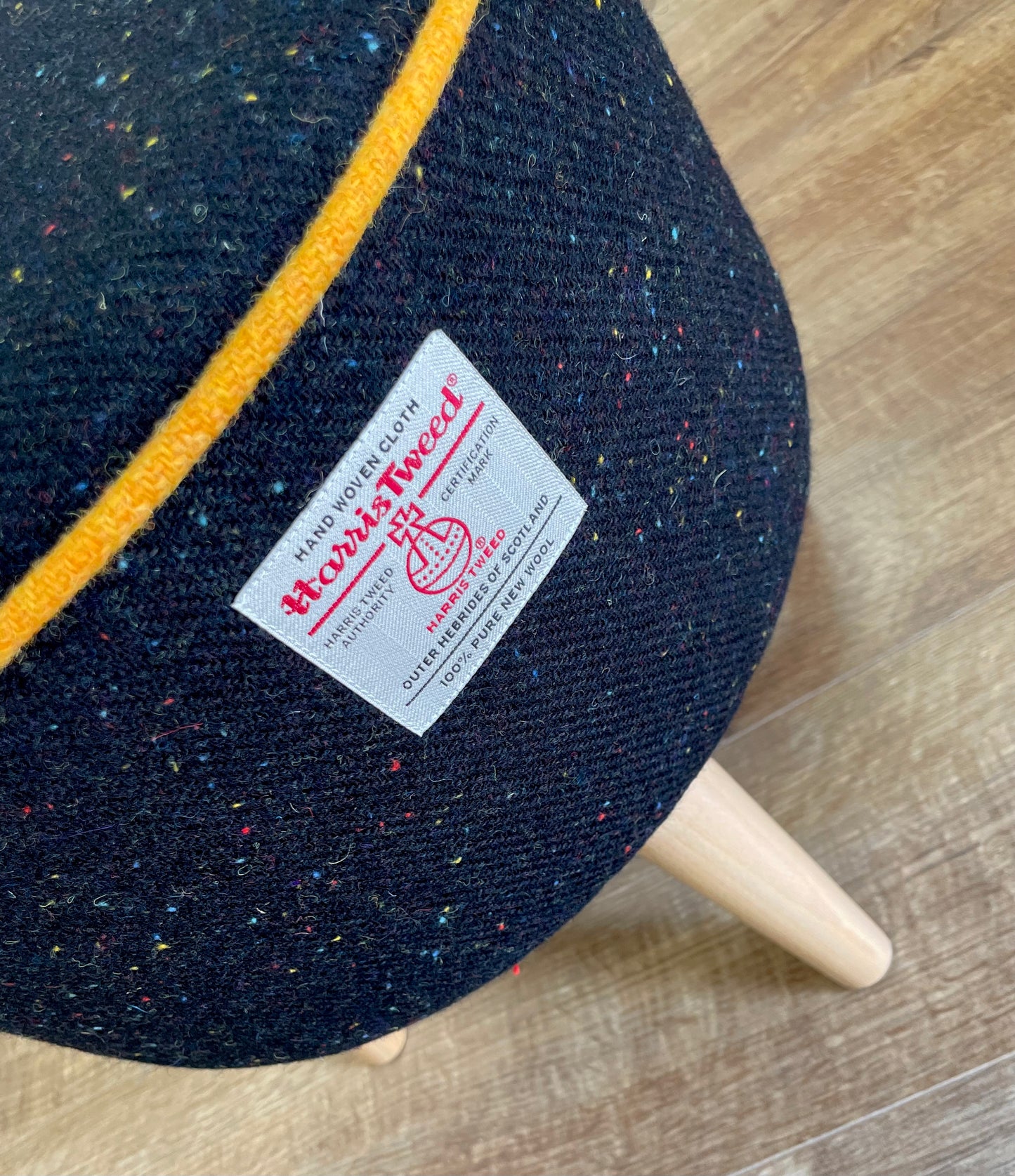 Black Speckled Harris Tweed Footstool with Yellow Piping Detail