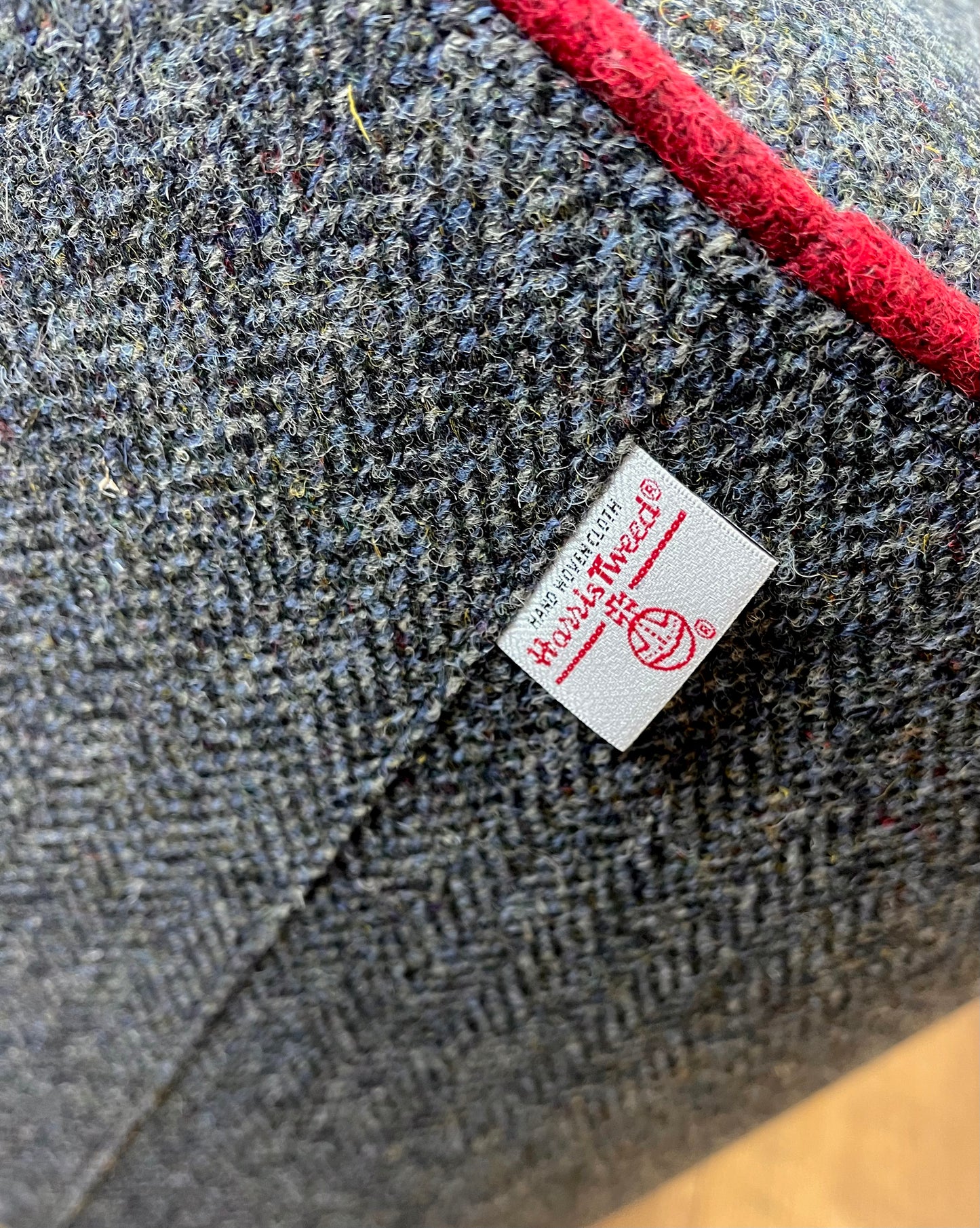 Charcoal Harris Tweed Chunky Floating Footstool with Red Piping