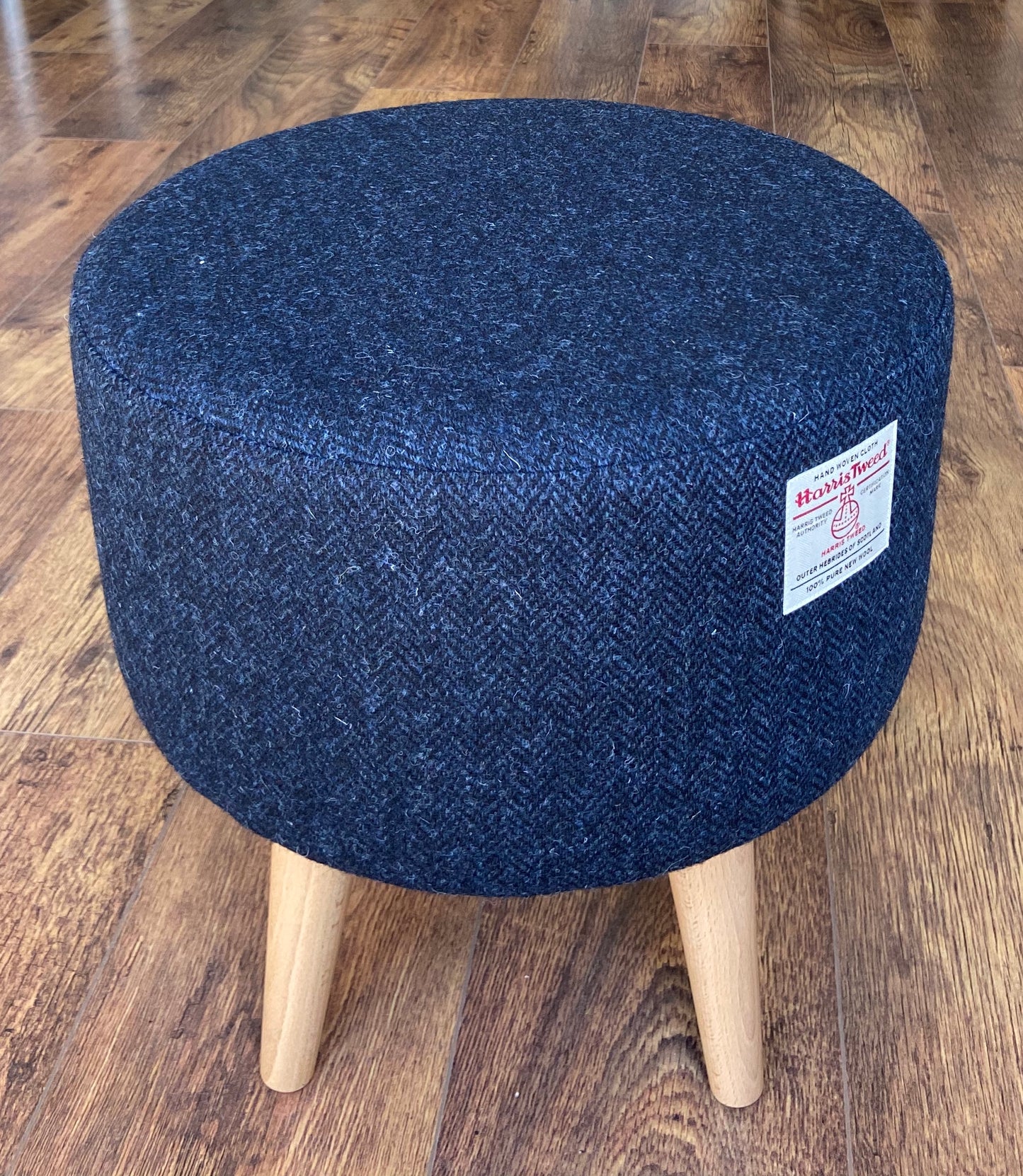 Navy Blue Harris Tweed Upholstered Footstool with Varnished Wooden Legs.