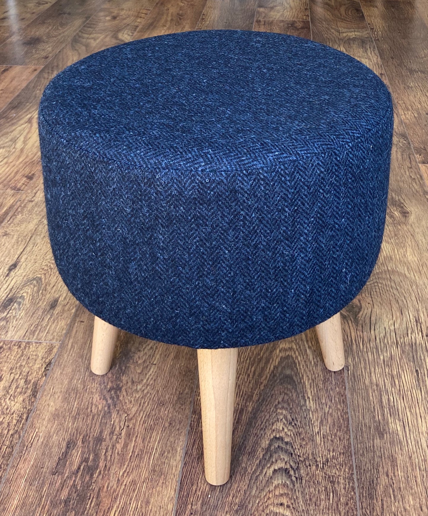 Navy Blue Harris Tweed Upholstered Footstool with Varnished Wooden Legs.