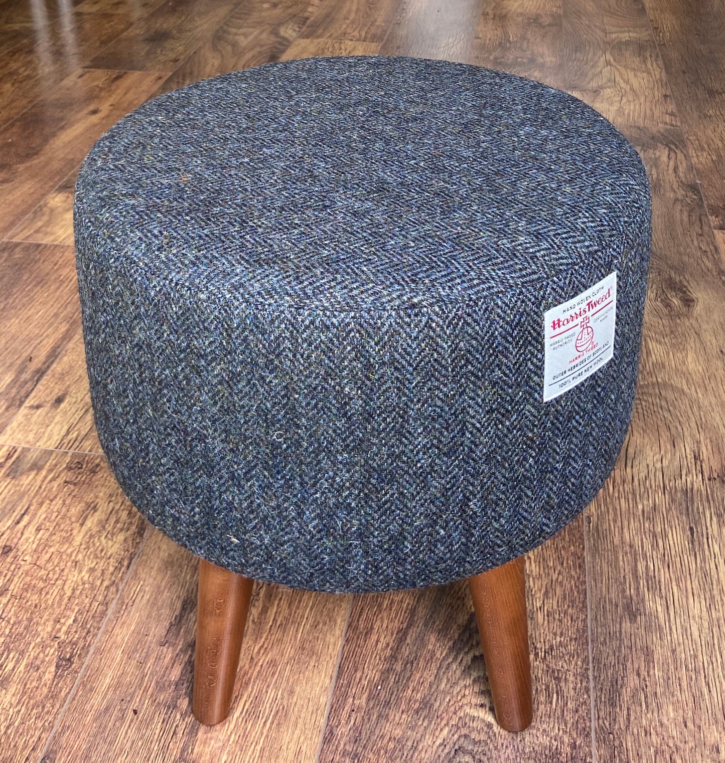 Charcoal Harris Tweed Upholstered Footstool with Dark Varnished Wooden Legs.