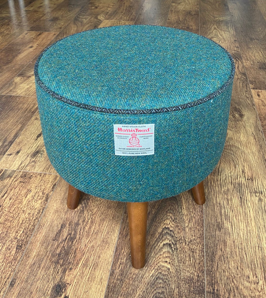 Green Harris Tweed Footstool with Charcoal Piping and Dark Varnished Wooden Legs.