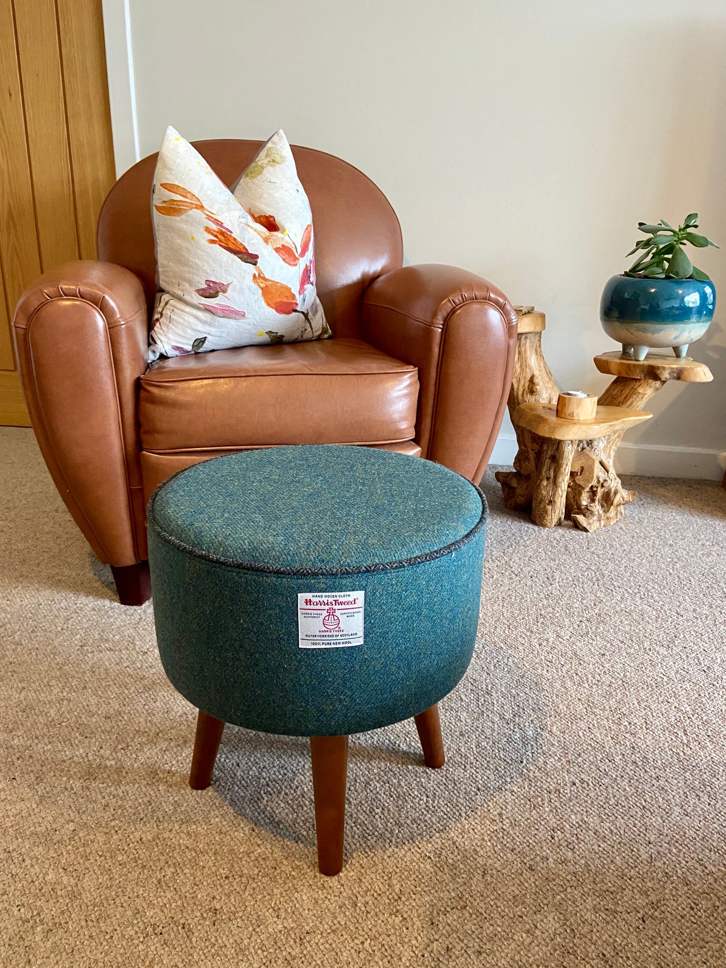 Green Harris Tweed Footstool with Charcoal Piping and Dark Varnished Wooden Legs.