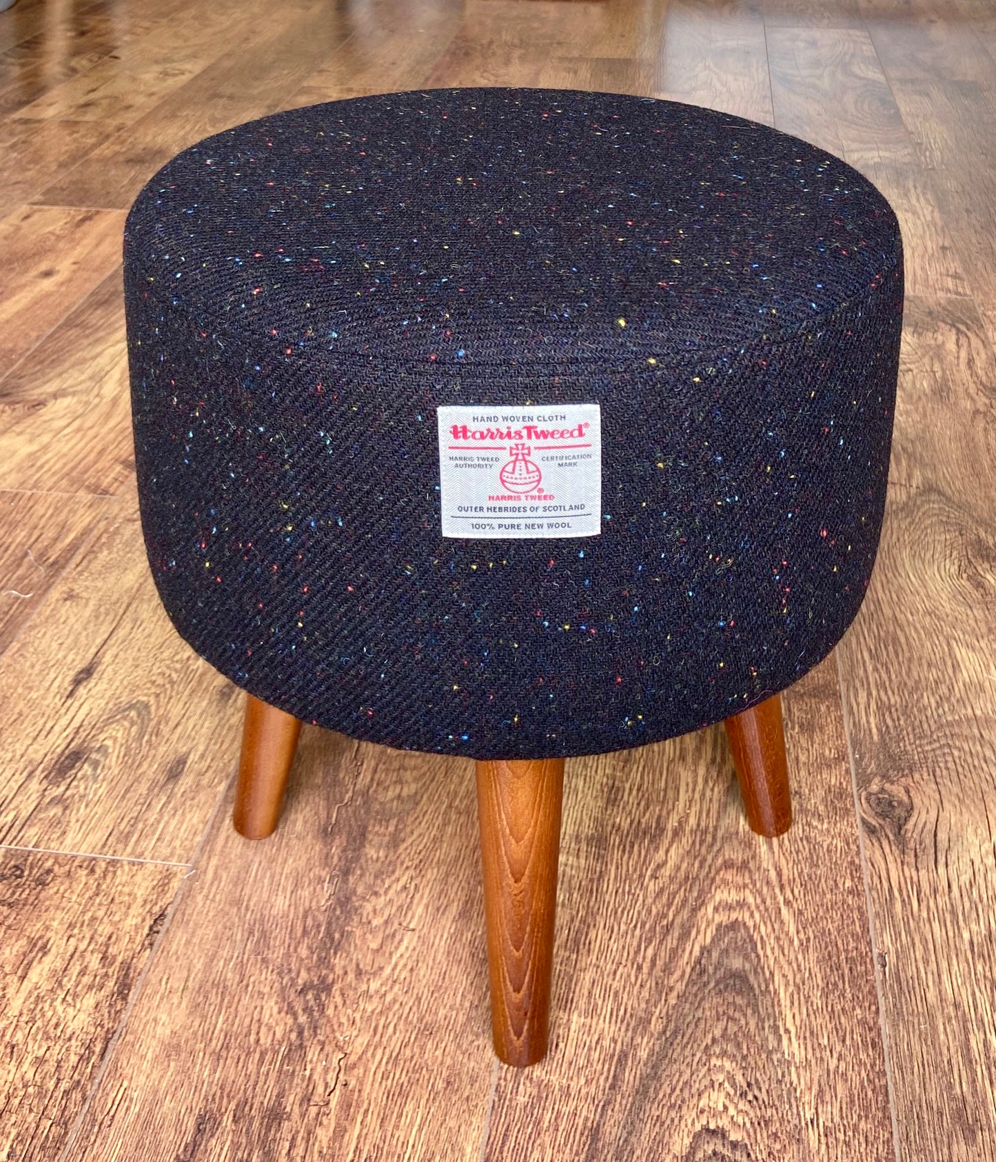 Black Speckled Harris Tweed Footstool with Dark Varnished Wooden Legs