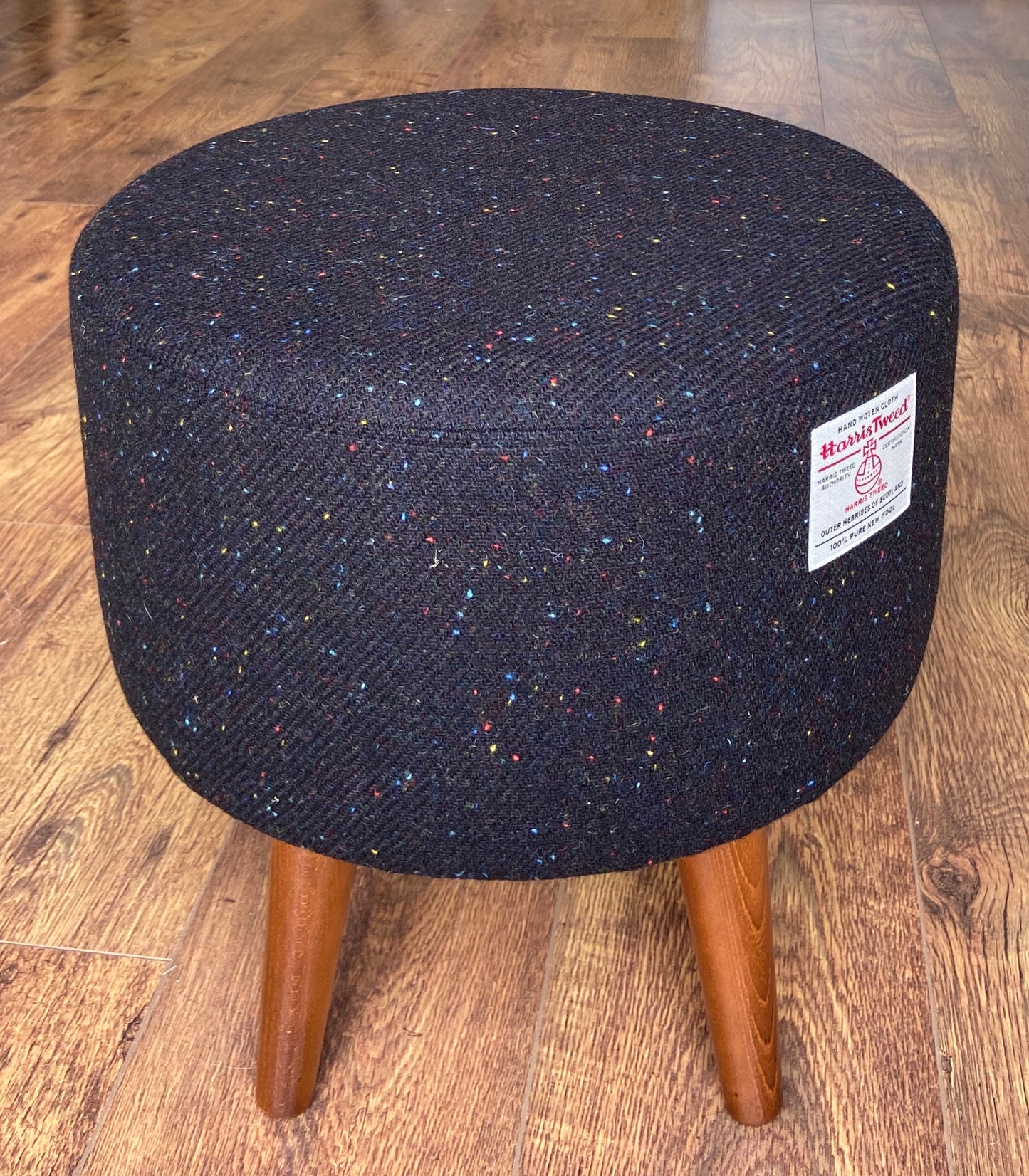 Black Speckled Harris Tweed Footstool with Dark Varnished Wooden Legs