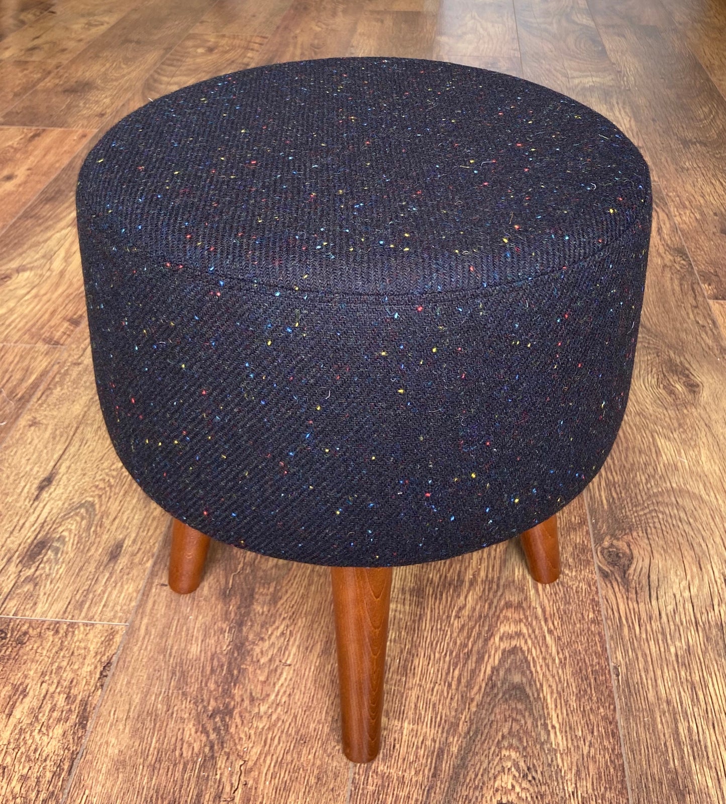 Black Speckled Harris Tweed Footstool with Dark Varnished Wooden Legs