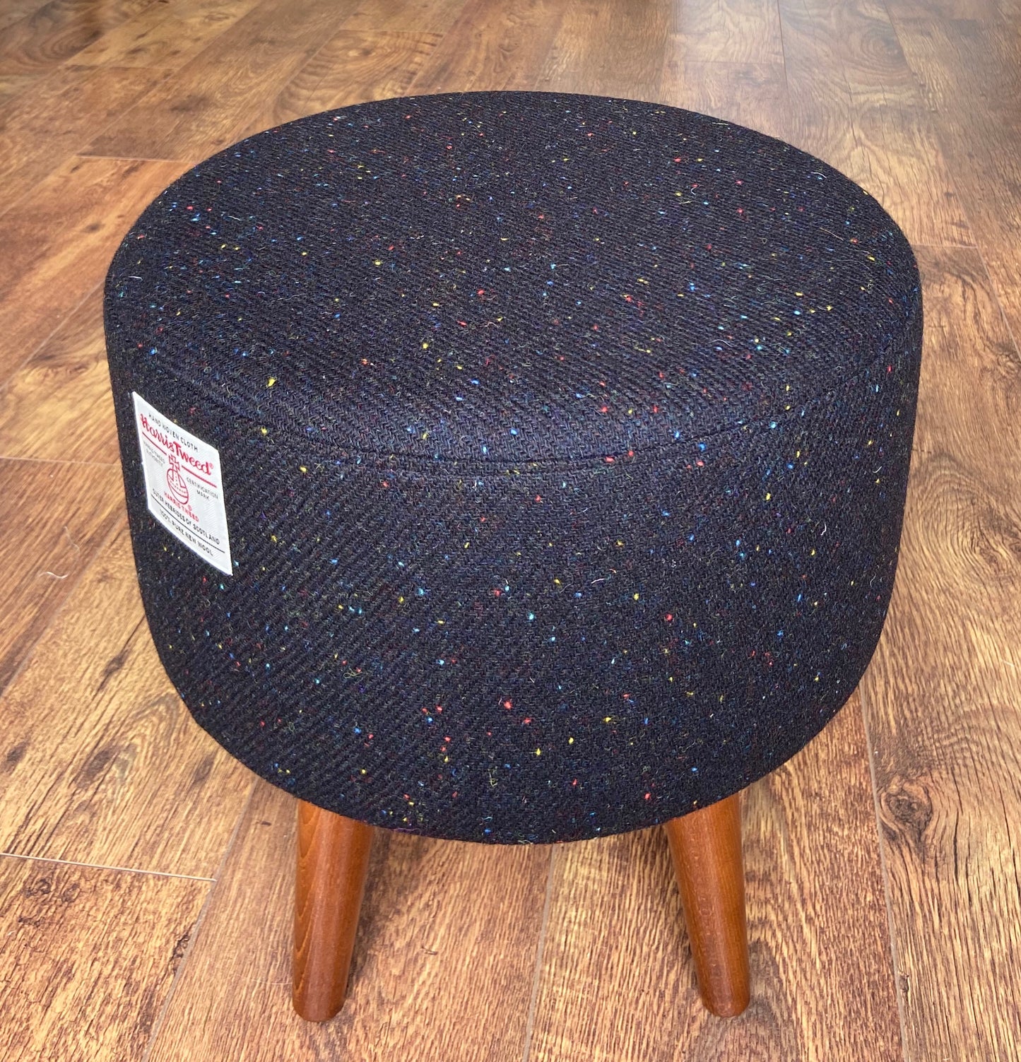 Black Speckled Harris Tweed Footstool with Dark Varnished Wooden Legs