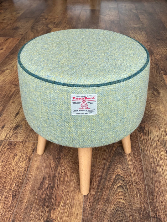 Light Green Harris Tweed Footstool with Dark Green Piping and Varnished Wooden Legs.