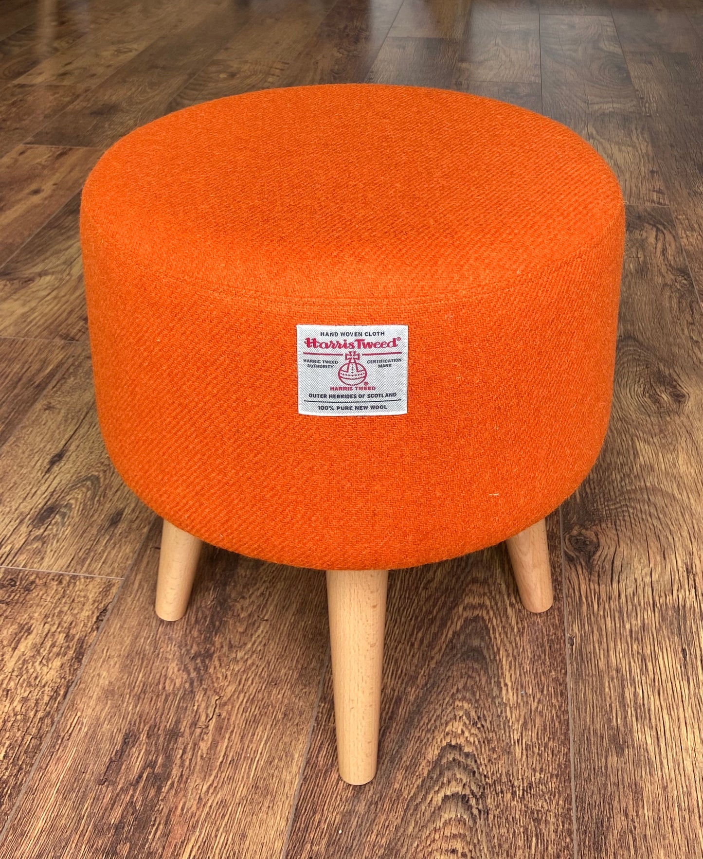 Upholstered Orange Harris Tweed Footstool with Varnished Wooden Legs