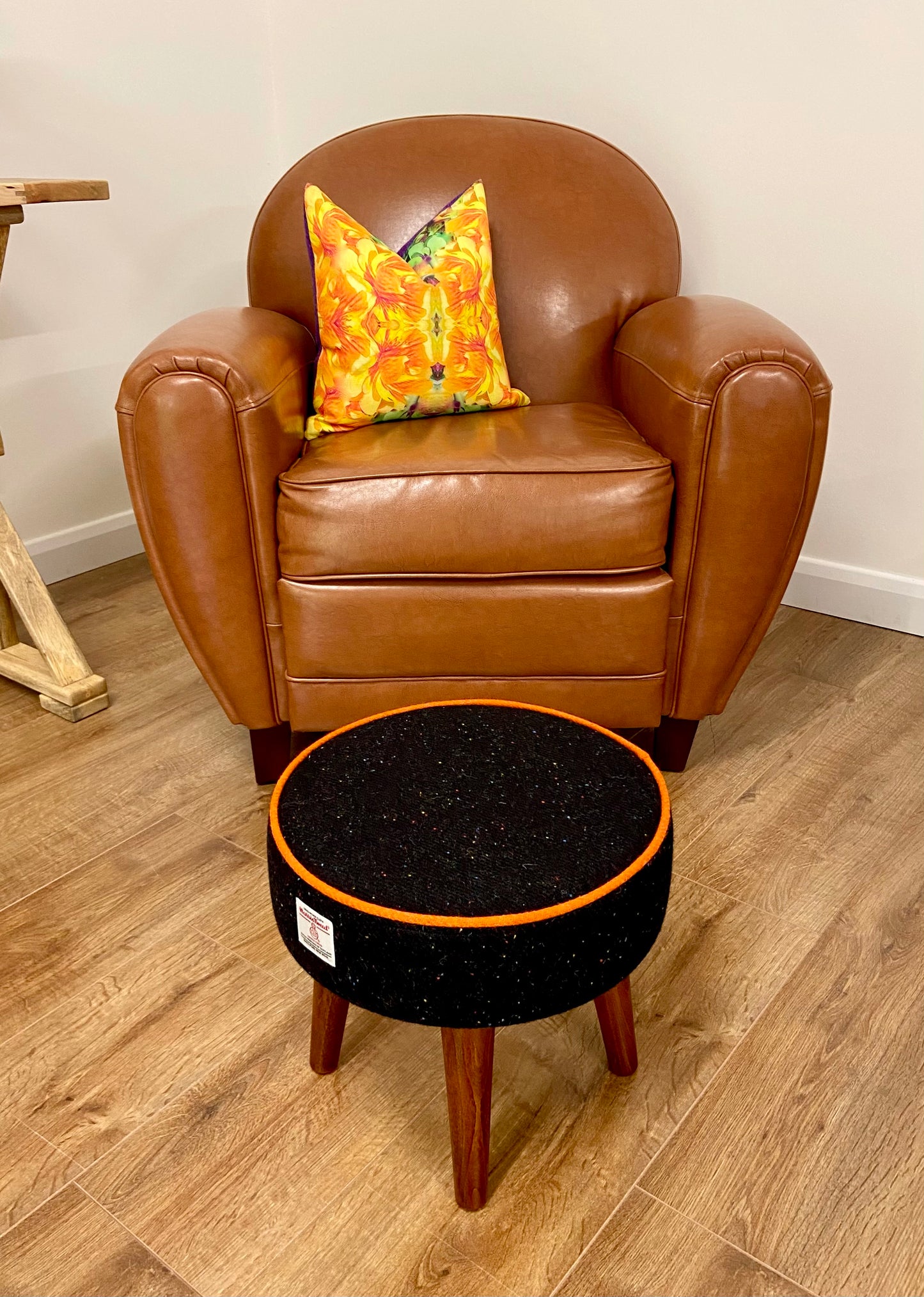 Black Speckled Harris Tweed Footstool with Orange Piping and Dark Varnished Wooden Legs