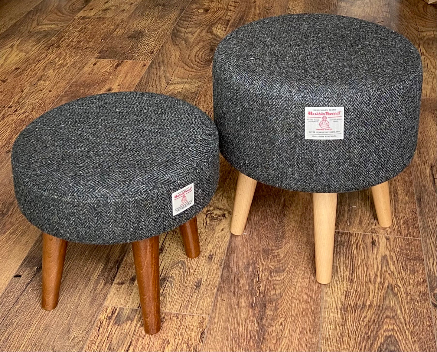 Charcoal Harris Tweed Upholstered Footstool with Dark Varnished Wooden Legs.