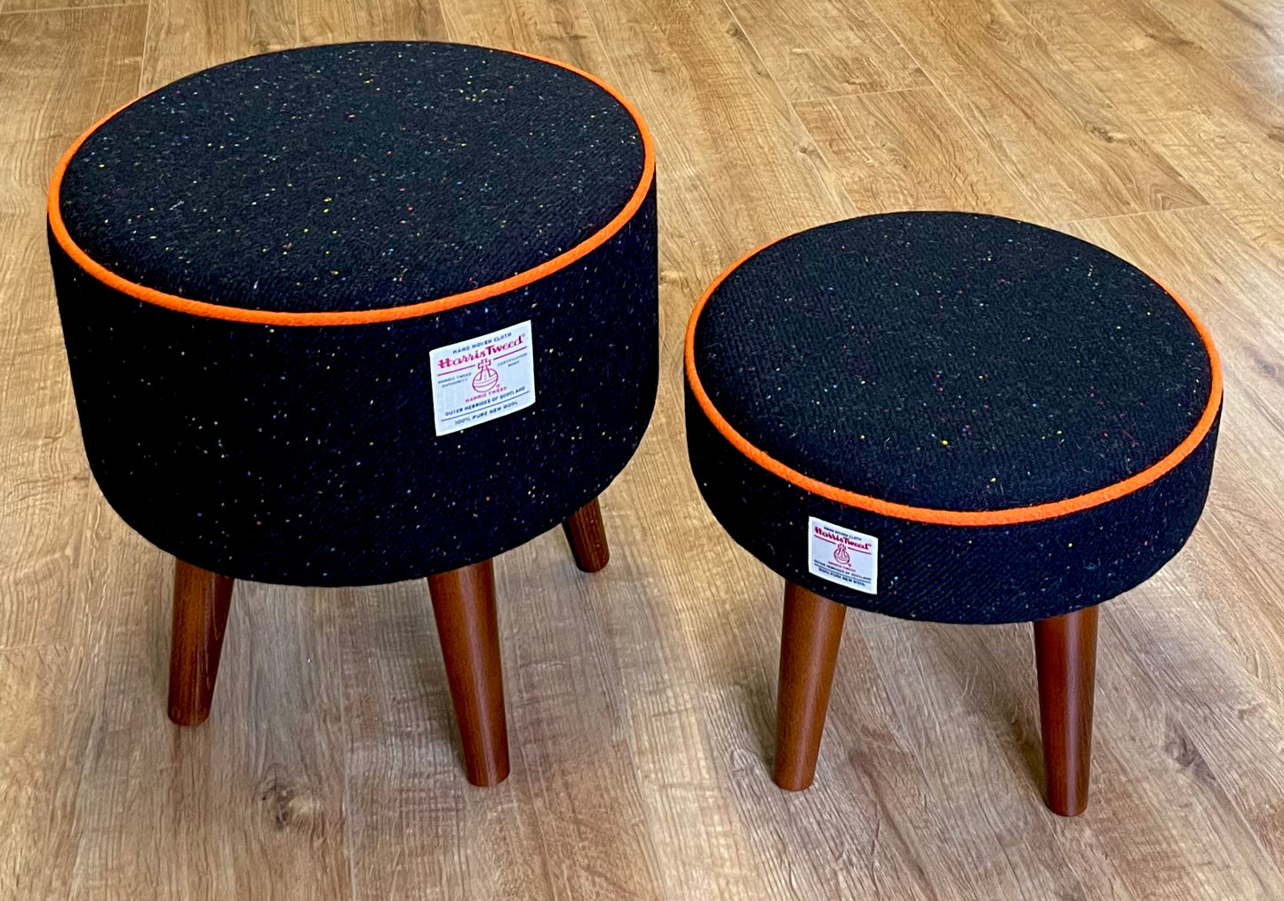 Black Speckled Harris Tweed Footstool with Orange Piping and Dark Varnished Wooden Legs